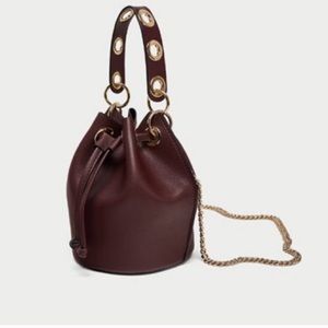Zara mini bucket bag with eyelets.